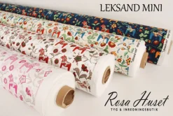 Gardintyger Mönstrade|Arvidssons Textil<Arvidssons textil Leksand mini natur tyg med traditionellt dalahästtryck