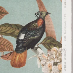 Gardintyger Mönstrade< Philodendron tyg - turkost med tropiska fåglar och blommor